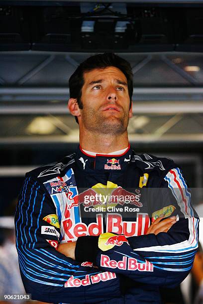 Mark Webber of Australia and Red Bull Racing prepares in his team garage during the final practice session prior to qualifying for the Italian...