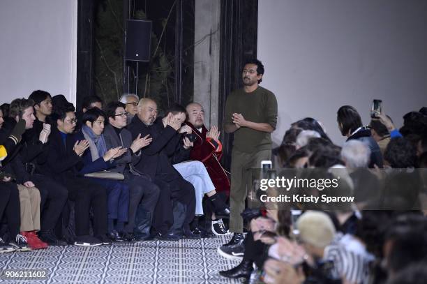 Designer Haider Ackermann acknowledges the audience during the Haider Ackermann Menswear Fall/Winter 2018-2019 show as part of Paris Fashion Week on...