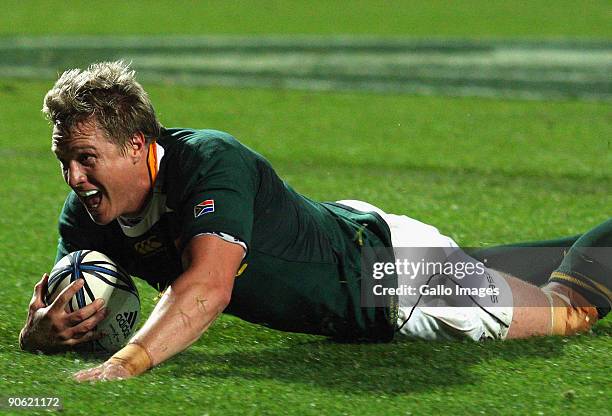 Jean de Villiers of South Africa scores a try during the Tri Nations Test between the New Zealand All Blacks and South African Springboks at Waikato...
