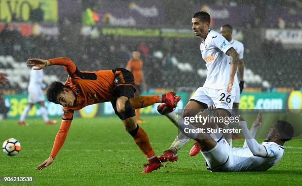 Morgan Gibbs-White of Wolverhampton Wanderers is tackled by Kyle Naughton of Swansea City and Leroy Fer of Swansea City during The Emirates FA Cup...