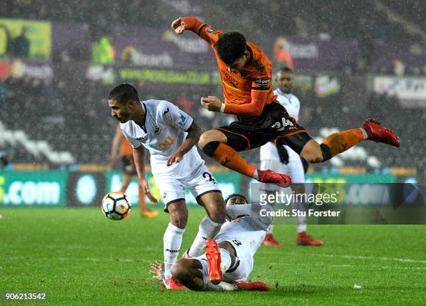 Morgan Gibbs-White of Wolverhampton Wanderers is tackled by Kyle Naughton of Swansea City and Leroy Fer of Swansea City during The Emirates FA Cup...