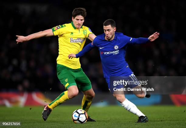 Timm Klose of Norwich City and Eden Hazard of Chelsea in action during The Emirates FA Cup Third Round Replay between Chelsea and Norwich City at...