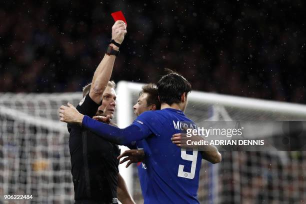 Chelsea's Spanish striker Alvaro Morata receives a red card from referee Graham Scott during the FA Cup third round replay football match between...