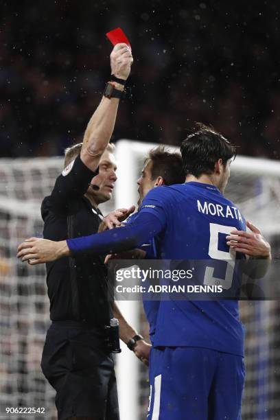 Chelsea's Spanish striker Alvaro Morata receives a red card from referee Graham Scott during the FA Cup third round replay football match between...