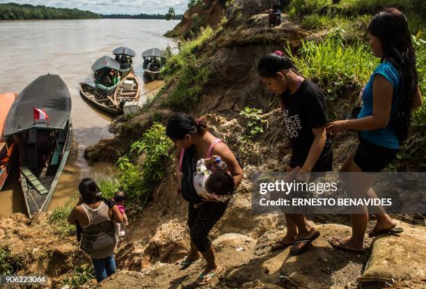 Members of the indigenous community of Palma Real, belonging to the Ese Ejja etnia, get ready to travel to Puerto Maldonado for the visit of Pope...