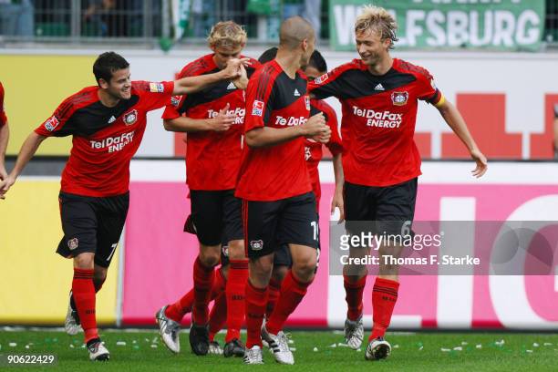 Simon Rolfes and Tranquillo Barnetta of Leverkusen celebrate their team's first goal during the Bundesliga match between VfL Wolfsburg and Bayer...