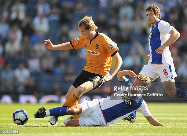 Richard Stearman of Wolves battles with Morten Gamst Pedersen of Blackburn Rovers during the Barclays Premier League match between Blackburn Rovers...