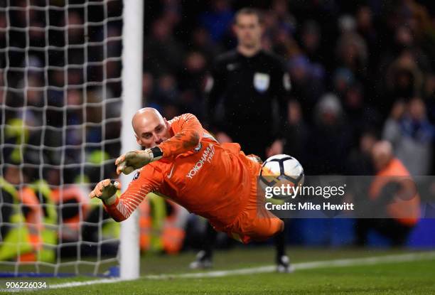 Willy Caballero of Chelsea saves a penalty from Nelson Oliveira of Norwich City during The Emirates FA Cup Third Round Replay between Chelsea and...