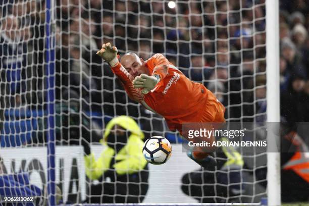 Chelsea's Argentinian goalkeeper Willy Caballero saves the penalty from Norwich City's Portuguese striker Nelson Oliveira during the FA Cup third...