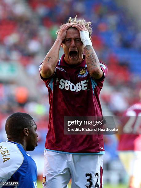 Alessandro Diamanti of West Ham reacts to hitting the post with a shot during the Barclays Premier League match between Wigan Athletic and West Ham...