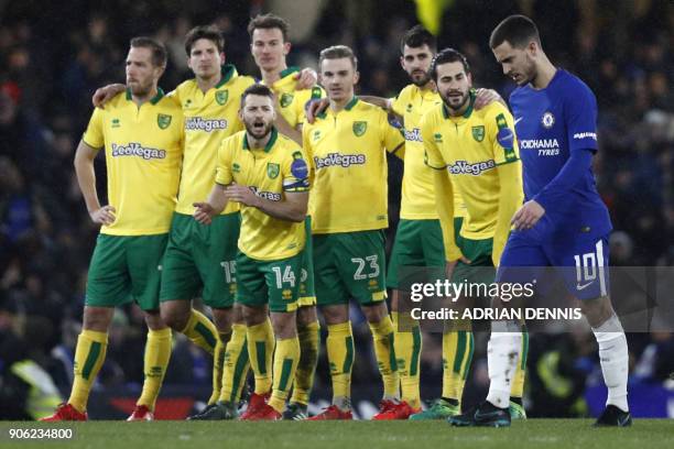 Chelsea's Belgian midfielder Eden Hazard walks to take his penalty during the FA Cup third round replay football match between Chelsea and Norwich...