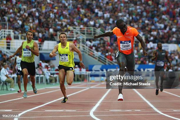 Kerron Clement of USA dips for the line and claim victory in the men's 400m hurdles from LJ van Zyl of South Africa and Periklis Iakovakis of Greece...