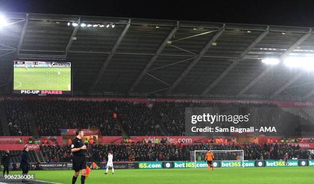 The travelling away fans of Wolverhampton Wanderers during The Emirates FA Cup Third Round Replay between Swansea City and Wolverhampton Wanderers at...