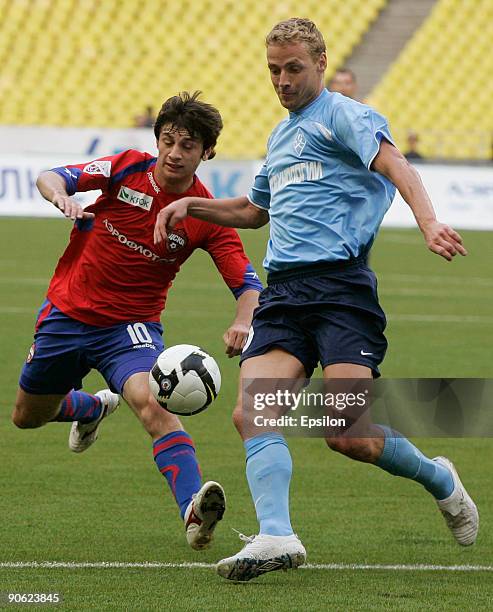 Alan Dzagoev of FC CSKA battles for the ball with Jiri Jarosik of Krylia Sovetov during the Russian Football League Championship match between FC...