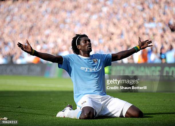 Emmanuel Adebayor of Manchester City celebrates in front of the Arsenal fans after scoring during the Barclays Premier League match between...