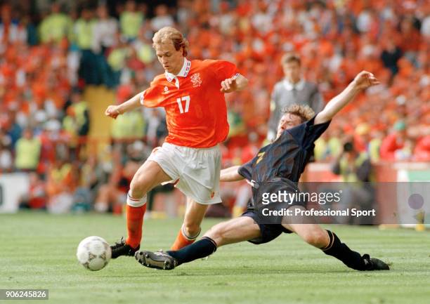 Jordi Cruyff of the Netherlands beats Stewart McKimmie of Scotland during their UEFA Euro96 Group A match at Villa Park in Birmingham on 10th June...