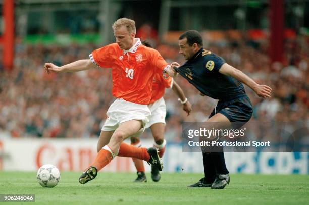 Dennis Bergkamp of the Netherlands holds off Colin Calderwood of Scotland during their UEFA Euro96 Group A match at Villa Park in Birmingham on 10th...