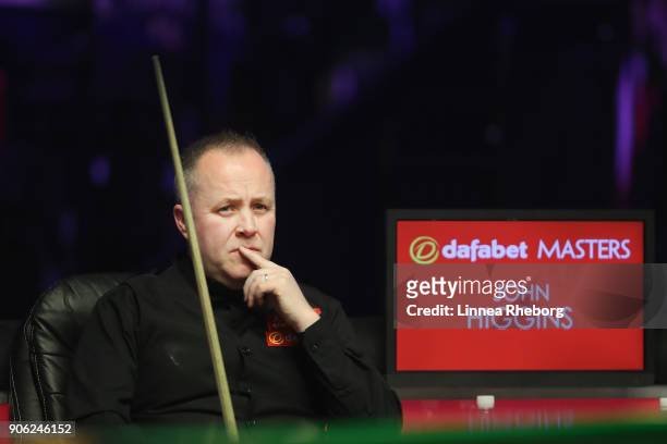 John Higgins of Scotland reacts during his first round match against Anthony McGill of Scotland on day four of The Dafabet Masters at Alexandra...