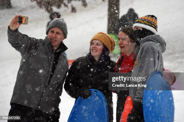 People pose for a photo at Dorothea Dix Park during a snow storm on January 17, 2018 in Raleigh, North Carolina. North Carolina Gov. Roy Cooper...