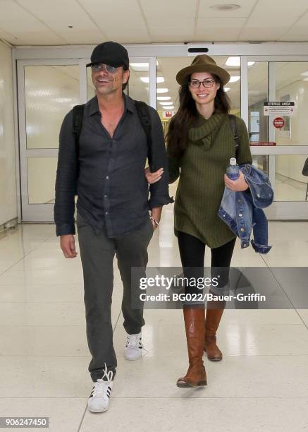 John Stamos and Caitlin McHugh are seen on January 17, 2018 in Los Angeles, California.