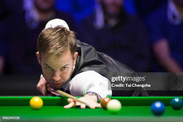 Ali Carter of England plays a shot during his first round match against Shaun Murphy of England on day four of The Dafabet Masters at Alexandra...