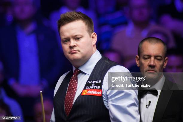 Shaun Murphy of England reacts during his first round match against Ali Carter of England on day four of The Dafabet Masters at Alexandra Palace on...