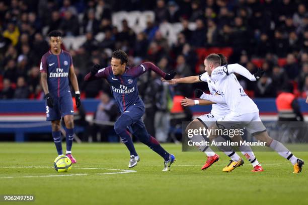 Neymar Jr of Paris Saint-Germain escapes from 2 defenders during the Ligue 1 match between Paris Saint Germain and Dijon FCO at Parc des Princes on...