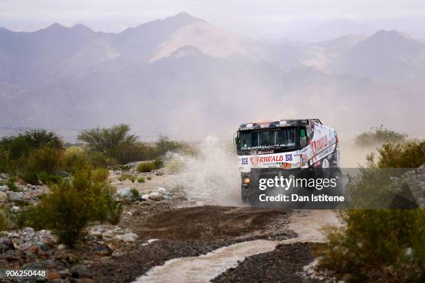 Gert Huzink of the Netherlands and Riwald Dakar drives with co-driver Rob Buursen of the Netherlands and mechanic Martin Roesnik of the Netherlands...