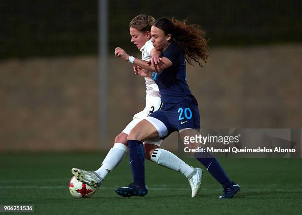 Leonie Koster of Germany competes for the ball with Eboney Salmon of England during the international friendly match between U17 Girl's Germany and...