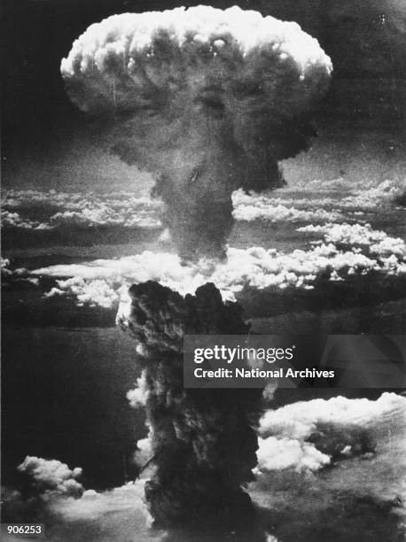 Dense column of smoke rises more than 60,000 feet into the air over the Japanese industrial port of Nagasaki, the result of an atomic bomb, the...