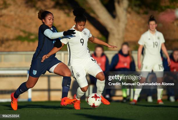 Shekiera Martinez of Germany competes for the ball with Lauren James of England during the international friendly match between U17 Girl's Germany...