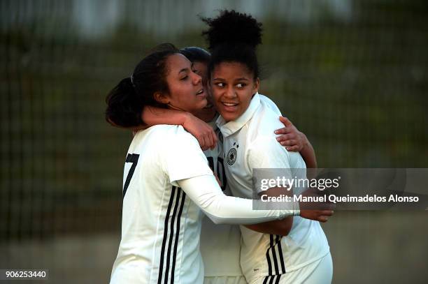 Ivana Fuso of Germany celebrates scoring her team's first goal with her teammates Gia Corley and Shekiera Martinez during the international friendly...