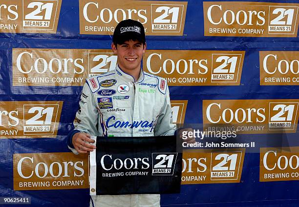 Colin Braun, driver of the Con-Way Freight Ford poses for a photo after winning the pole position for the Camping World truck race Copart 200 at the...