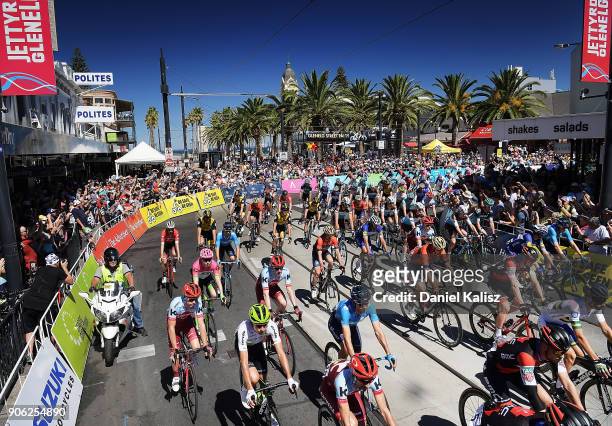 Riders compete in the neutral zone down Jetty Road, Glenelg at the start of stage three of the 2018 Tour Down Under on January 18, 2018 in Adelaide,...