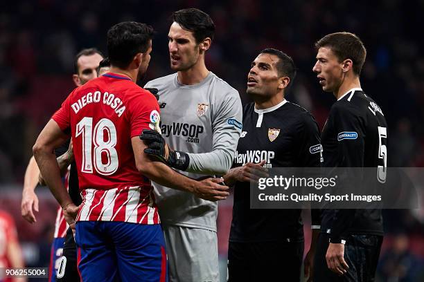 Diego Costa of Atletico de Madrid talks with Players of Sevilla FC during the Copa del Rey, Round of 8, first Leg match between Atletico de Madrid...