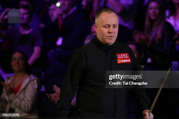 John Higgins of Scotland reacts during his first round match against Anthony McGill of Scotland on day four of The Dafabet Masters at Alexandra...