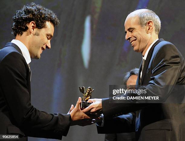 Israeli director Samuel Maoz and actor Yoav Donat hold the Golden Lion they received for the film "Lebanon" during the awards ceremony of the 66th...