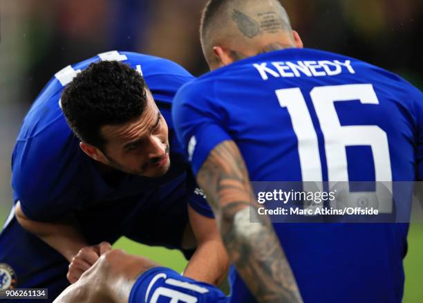 Pedro of Chelsea tends to injured teammate Kenedy during the Emirates FA Cup Third Round Replay match between Chelsea and Norwich City at Stamford...