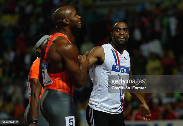 Tyson Gay of USA celebrates with Asafa Powell of Jamiaca after the Mens 100 metres during day one of the IAAF World Athletics Final at the...