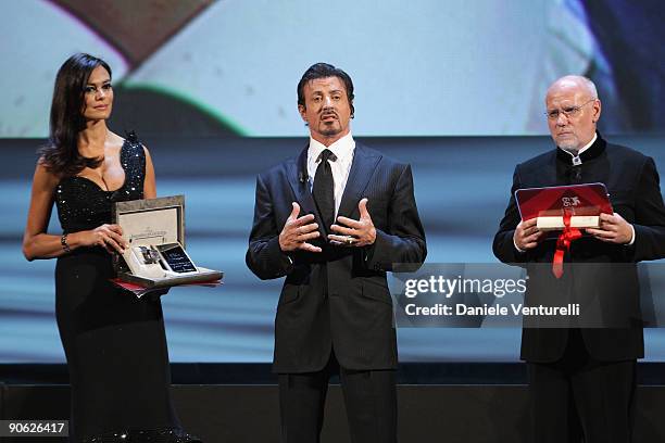 Actor Sylvester Stallone receives his Lifetime Achievement award from Festival director Marco Muller and Maria Grazia Cucinotta while attending the...