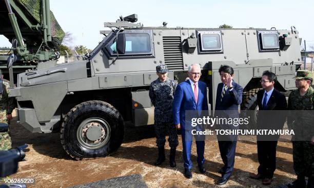 Visiting Australian Prime Minister Malcolm Turnbull holds a photo session with Japanese Prime Minister Shinzo Abe in front of an Australian-made...