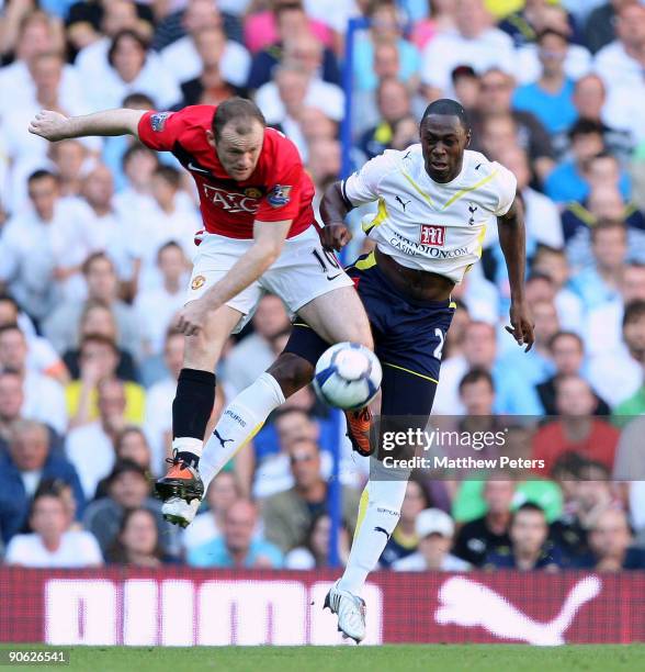 Wayne Rooney of Manchester United clashes with Ledley King of Tottenham Hotspur during the FA Barclays Premier League match between Tottenham Hotspur...