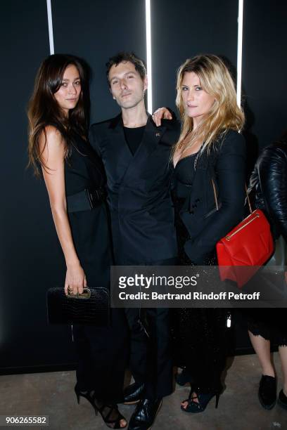 Actor Simon Buret standing between guests attend the "YSL Beauty Hotel" event during Paris Fashion Week Menswear Fall/Winter 2018-2019 on January 17,...