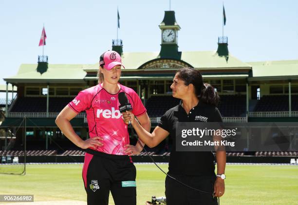 Sixers captain Ellyse Perry talks to cricketer and commentator Lisa Sthalekar after the coin toss during the Women's Big Bash League match between...