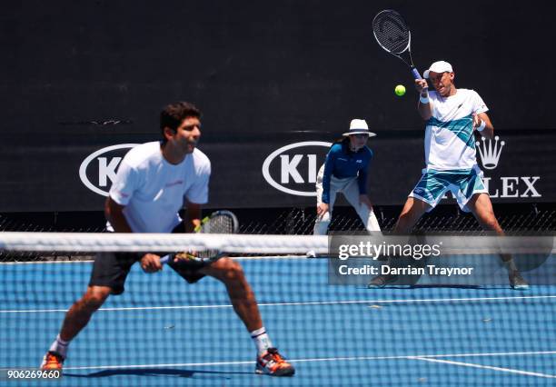 Lukasz Kubot of Poland and Marcelo Melo of Brazil compete in their first round men's doubles match against Paolo Lorenzi of Italy and Mischa Zverev...