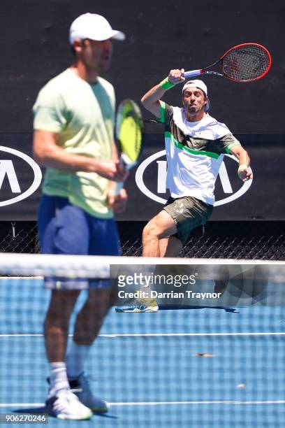 Paolo Lorenzi of Italy returns serve in his first round men's doubles match with Mischa Zverev of Germany against Lukasz Kubot of Poland and Marcelo...
