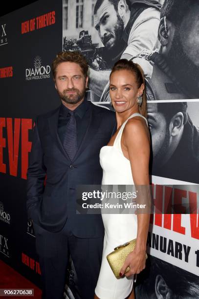 Gerard Butler and Morgan Brown attend the premiere of STX Films' "Den of Thieves" at Regal LA Live Stadium 14 on January 17, 2018 in Los Angeles,...