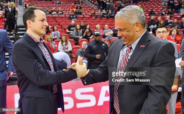 Head coach Paul Weir of the New Mexico Lobos and head coach Marvin Menzies of the UNLV Rebels exchange a greeting before their game at the Thomas &...