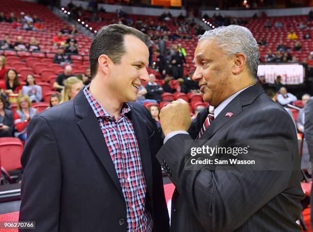 Head coach Paul Weir of the New Mexico Lobos and head coach Marvin Menzies of the UNLV Rebels exchange a greeting before their game at the Thomas &...