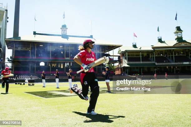 Ellyse Perry of the Sixers walks onto the field to bat during the Women's Big Bash League match between the Sydney Sixers and the Brisbane Heat at...